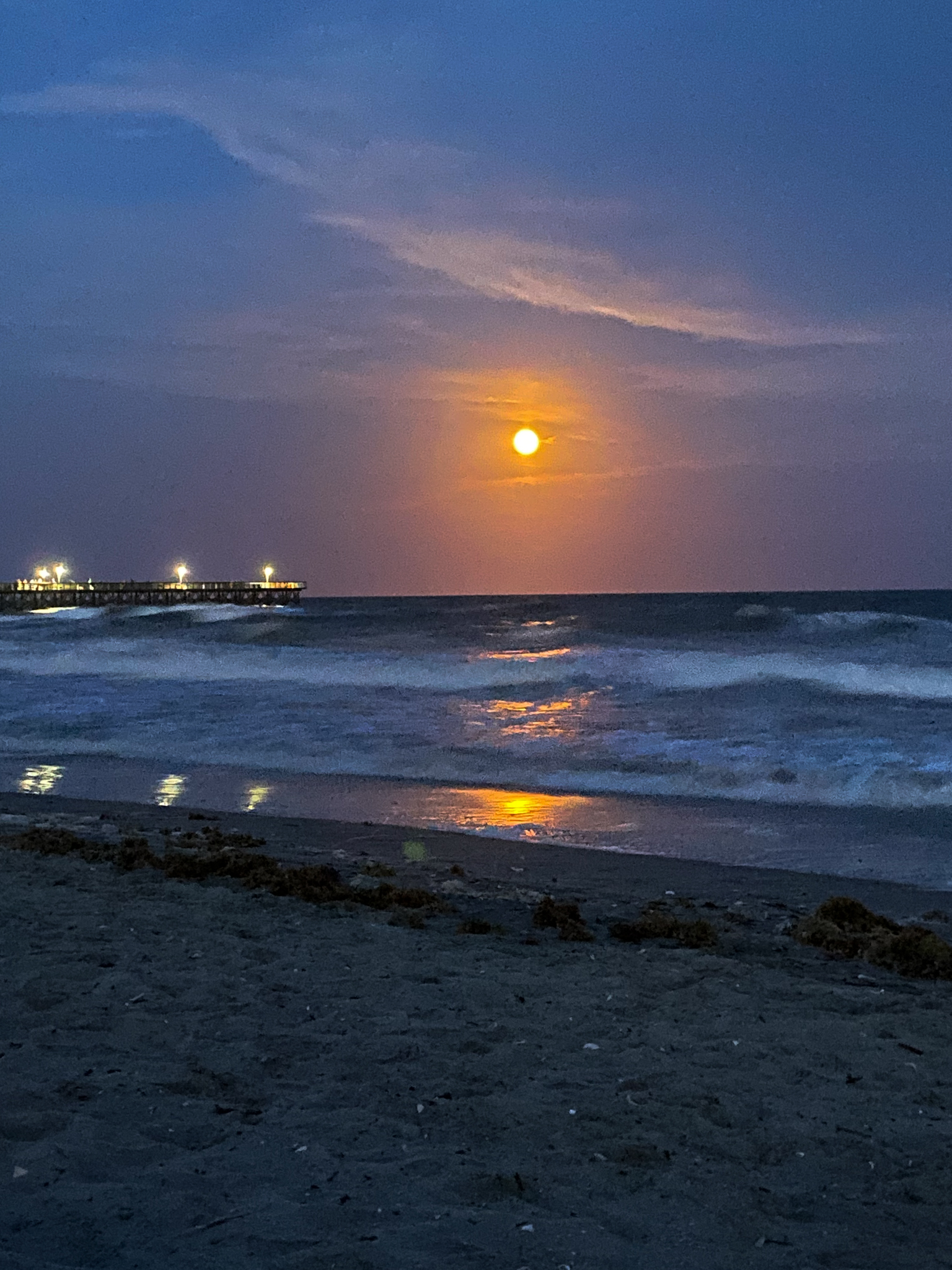 full moon over the ocean